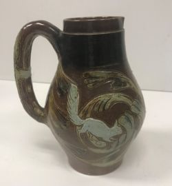A Martin ware bellied jug decorated with 3 “Running cats amongst foliage”,