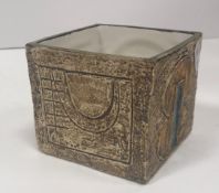 A Troika cube pot with relief decoration signed "Troika Cornwall SK" for Sue Kewell (1974/5) to