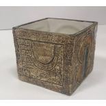 A Troika cube pot with relief decoration signed "Troika Cornwall SK" for Sue Kewell (1974/5) to