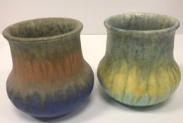 Two Ruskin vases, one in yellow and green/blue colour way,