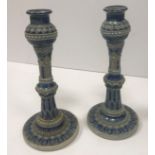 A pair of Martin Brothers incised blue glazed pottery candlesticks,