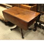 A Victorian mahogany drop leaf pembroke table with single end drawer opposite a dummy drawer on