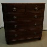 A Victorian mahogany bow fronted chest of two short over three long graduated drawers on turned