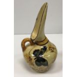 A William Ault Pottery ewer designed by Christopher Dresser with butterfly and floral decoration