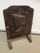 A Newlyn Arts & Crafts copper fire screen depicting Viking style longboats,