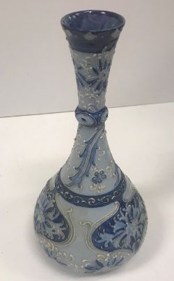 A Moorcroft MacIntyre florian ware vase with piped decoration with incised signature and inscribed