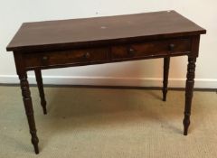 A Victorian mahogany two drawer side table on turned legs 113.5 cm wide x 53 cm deep x 78.