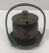 A Moorcroft fruit decorated conserve pot with hammered pewter basket type base and lid - Liberty