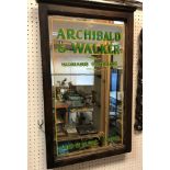 An early 20th Century stained wood framed advertising mirror,