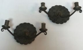 A pair of wrought iron Cotswold School twin branch wall lights,