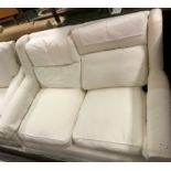 A Wesley Barrell cream ground two seat scroll arm sofa,