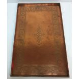 A large rectangular Keswick style copper tray with embossed foliate decorated border and knot