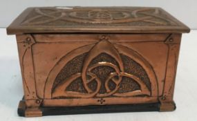 An Arts & Crafts style copper lidded box/casket with embossed Celtic knot style decoration to the