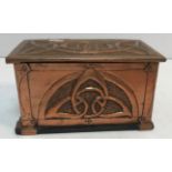 An Arts & Crafts style copper lidded box/casket with embossed Celtic knot style decoration to the