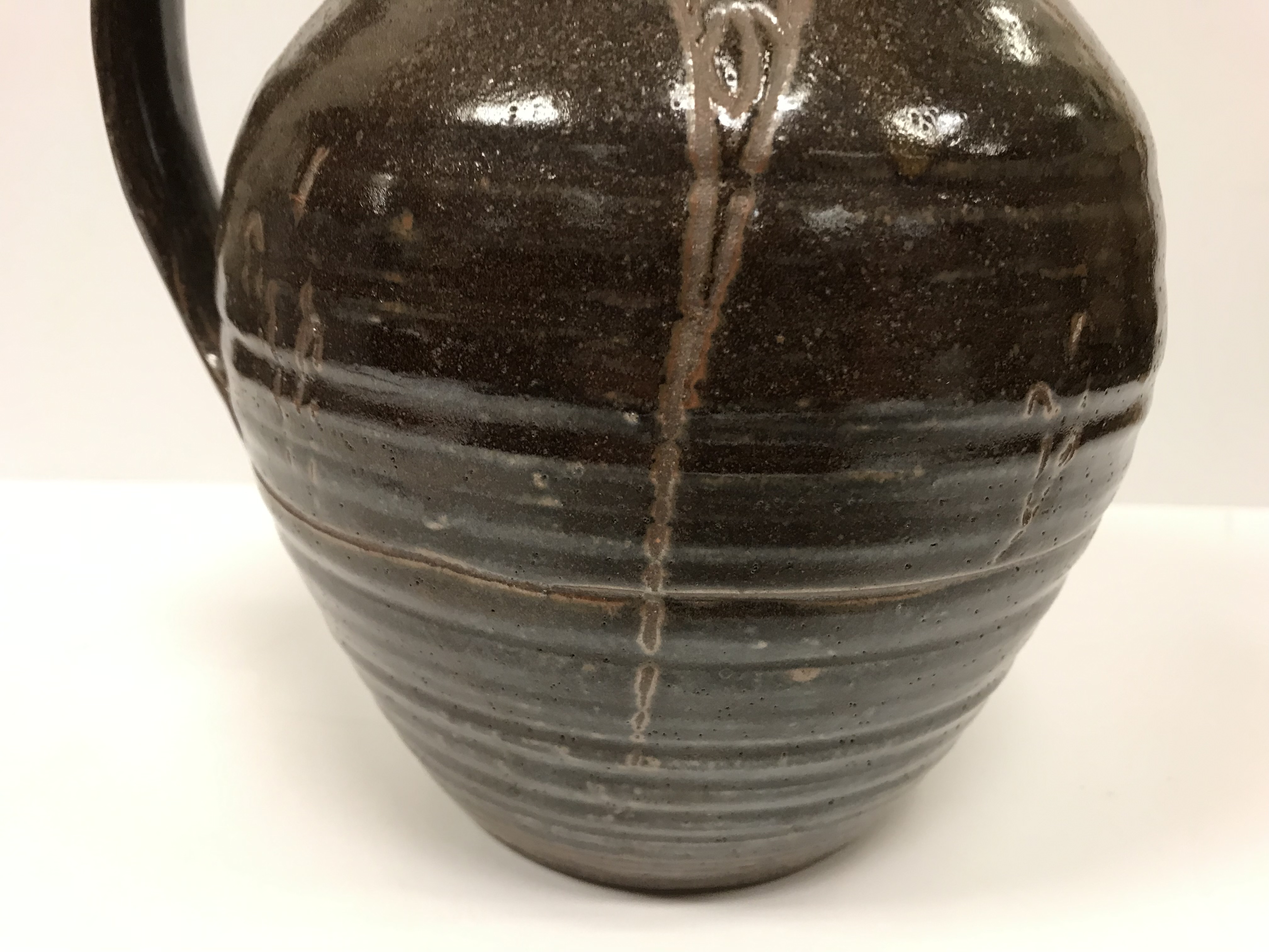 A Michael Cardew Wenfordbridge Pottery brown glazed ribbed jug with stylized floral spray - Image 4 of 22