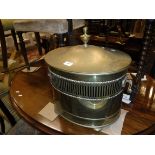An oval brass coal box in the Regency taste, mahogany bar back carver chair,