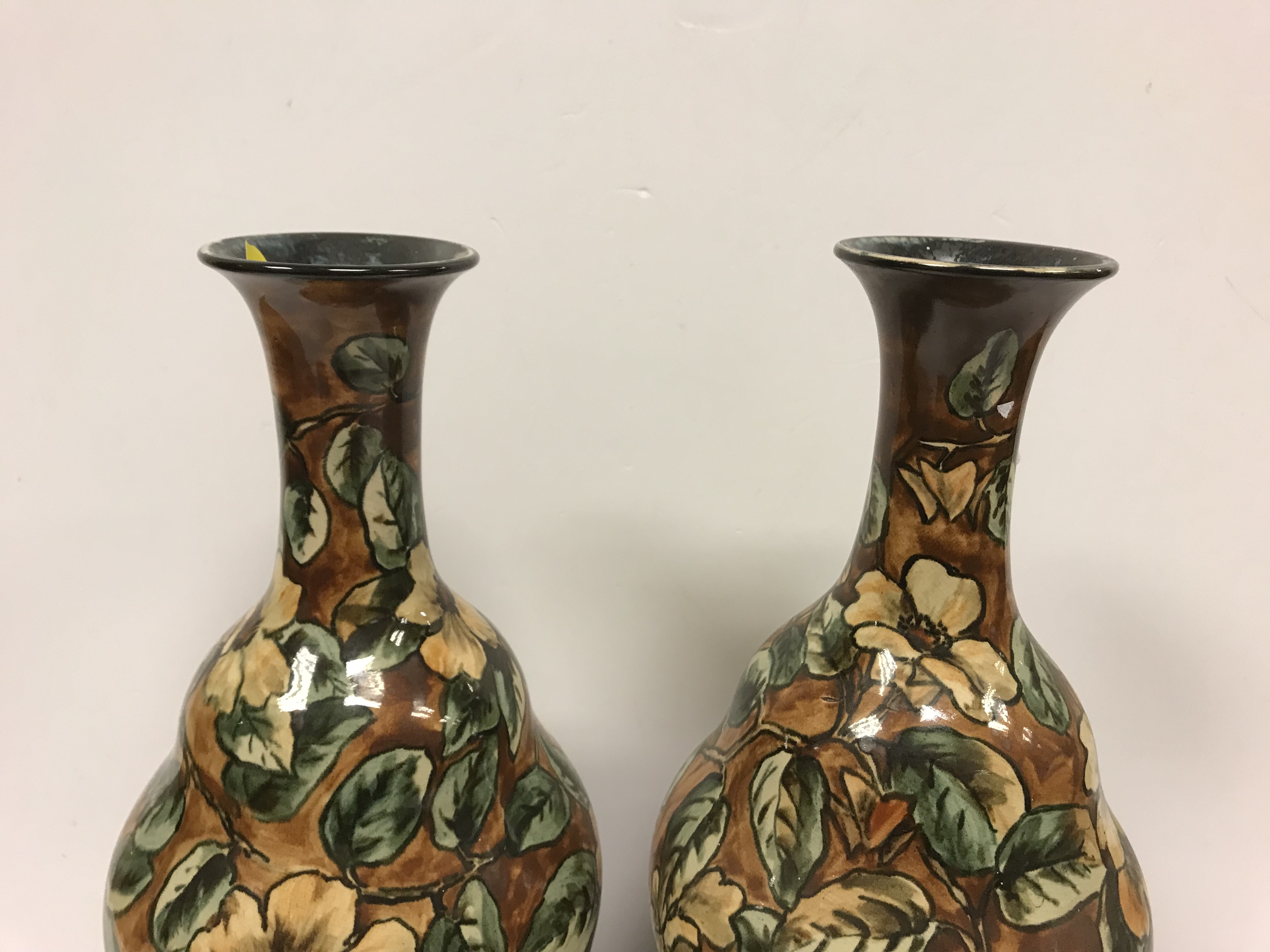 A pair of Doulton Lambeth faience ware vases, the brown ground set with floral decoration, - Image 10 of 22