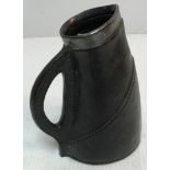 A Royal Doulton Lambeth blackjack jug with silver rim,