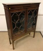 A 19th Century North Country oak and inlaid bookcase cabinet,