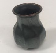 A Martin Brothers vase of wrythen form signed "Martin Brothers London" and No'd "9-98" to base 8 cm