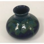 A Moorcroft "Moonlit" blue ground vase 10.