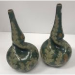 A pair of Doulton Lambeth foliate decorated vases with narrow rims,