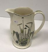 An Eric Ravilious for Wedgwood “Garden implements” decorated jug 19.