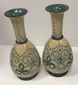 A pair of Doulton Impasto “Arabian” pattern relief work vases, bearing initial “CFM” for F. M.