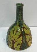 A Della Robbia Birkenhead Pottery vase of mallet form by Charles Collis decorated with stylised