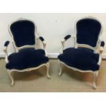 A pair of circa 1900 painted beech framed salon elbow chairs in the Louis XV taste with upholstered