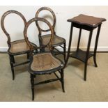 A set of three Victorian balloon back black lacquered and faux tortoiseshell decorated cane seated