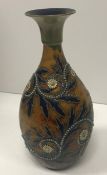 A George Tinworth Doulton Lambeth vase with scrolling foliate and floral decoration and flared rim,