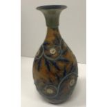 A George Tinworth Doulton Lambeth vase with scrolling foliate and floral decoration and flared rim,