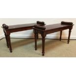 A pair of modern mahogany window seats in the Victorian style with turned cylinder handles flanking