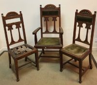 A set of three Art Nouveau oak dining chairs,