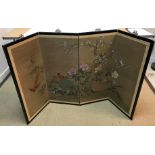 A Chinese hand-painted fabric panelled four-fold screen decorated with exotic birds amongst prunus