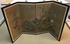 A Chinese hand-painted fabric panelled four-fold screen decorated with exotic birds amongst prunus