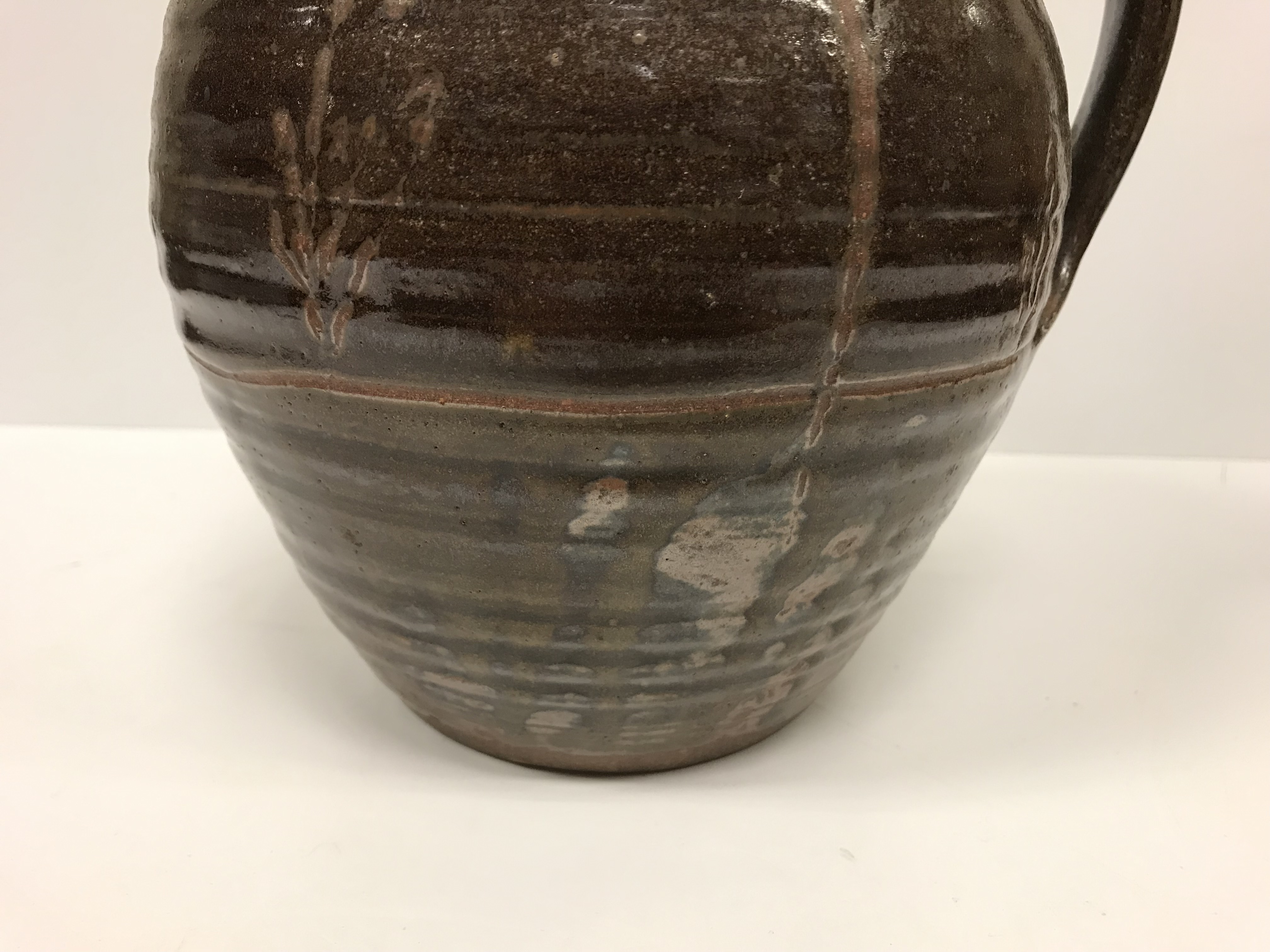 A Michael Cardew Wenfordbridge Pottery brown glazed ribbed jug with stylized floral spray - Image 10 of 22