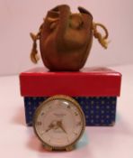 A Bueche Girod miniature bedside clock, yellow metal mounted with lidded skin banding,