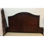 A modern mahogany and stained beech kingsize four poster bedstead in the 19th Century style,