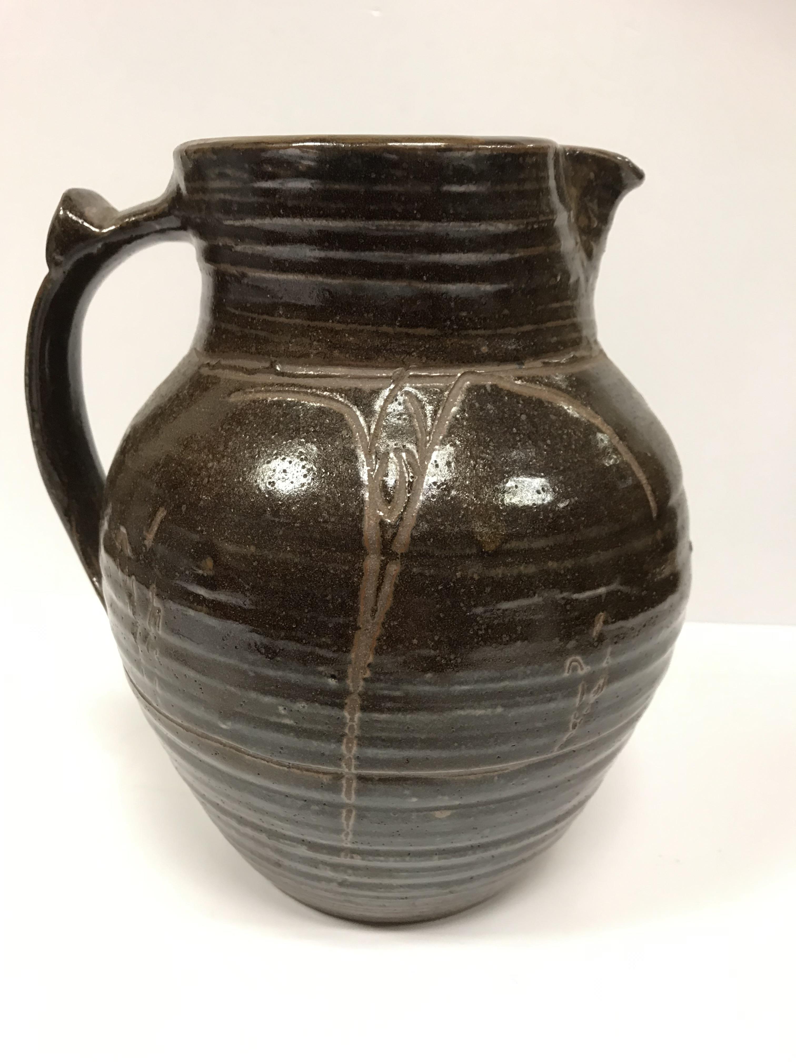 A Michael Cardew Wenfordbridge Pottery brown glazed ribbed jug with stylized floral spray - Image 2 of 22