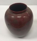 A Bernard Moore flambé vase with prunus decoration signed "Bernard Moore" to base but rubbed 18 cm