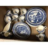 A Wedgwood and Barlaston of Etruria willow pattern part dinner service with cups, saucers, plates,
