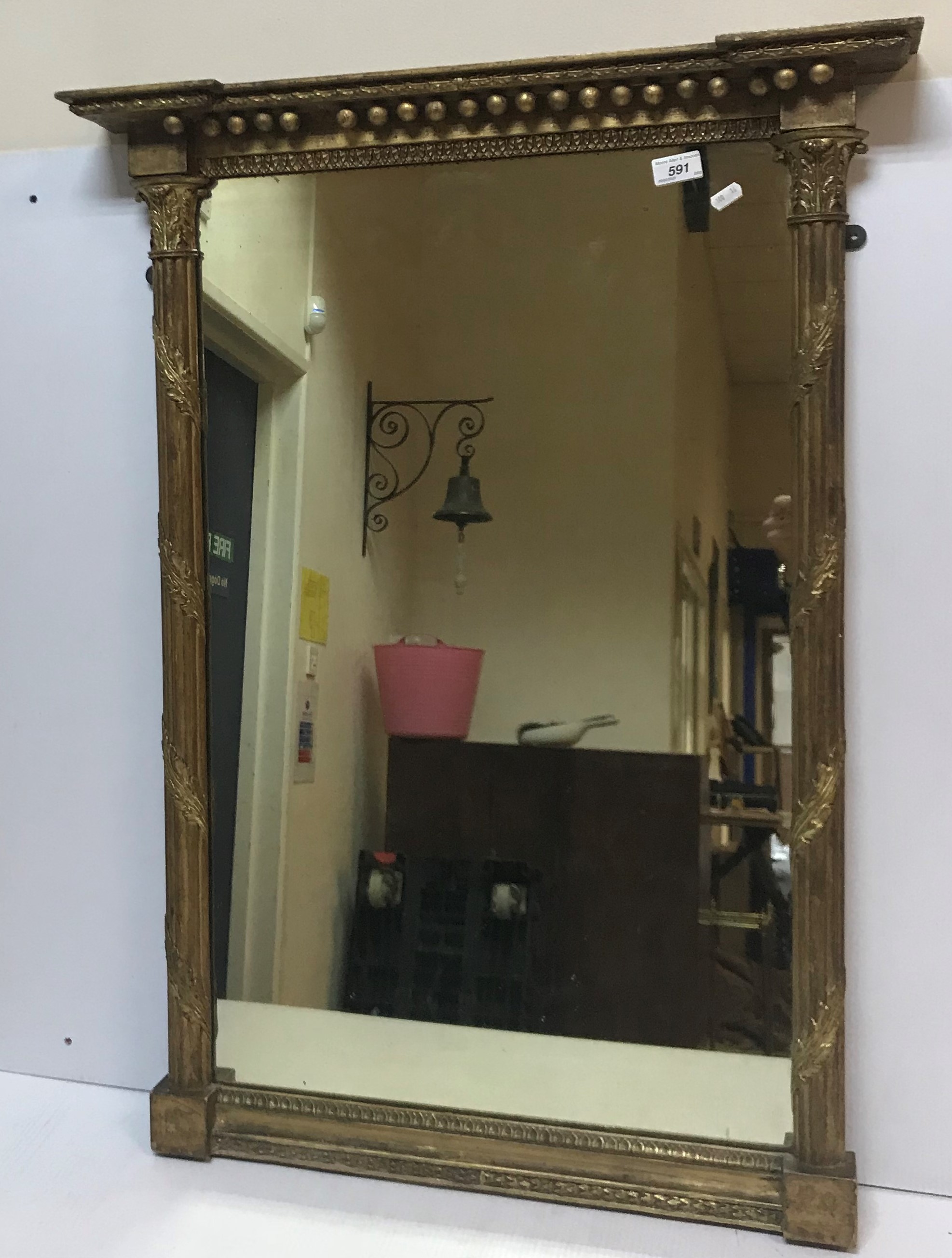 A 19th Century gilt framed mirror with column supports and acanthus decoration,