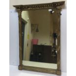 A 19th Century gilt framed mirror with column supports and acanthus decoration,