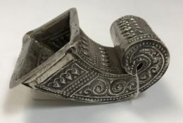 A late 19th/early 20th Century silver betel leaf holder of scrollwork form,