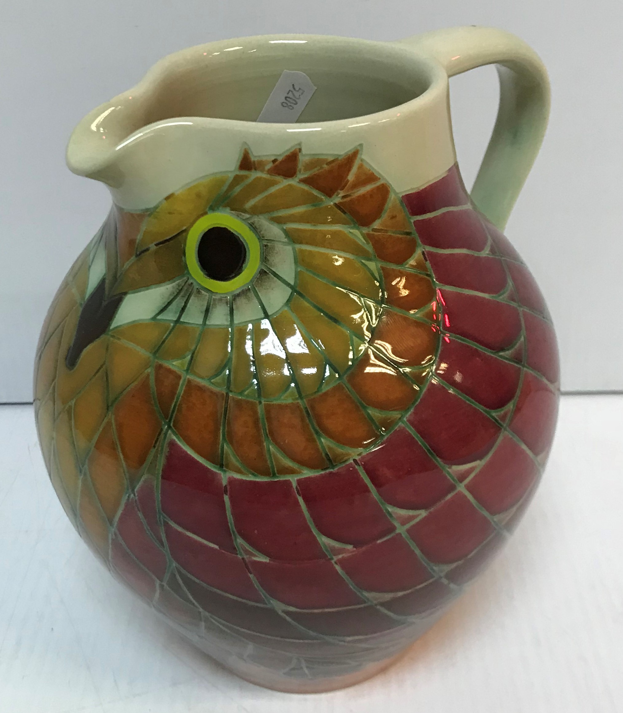 A Dennis Chinaworks jug in the form of an owl designed by Sally Tuffin initalled and No'd 33 to