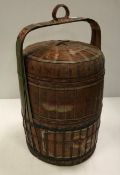 A South East Asian painted raffia work food box of cylindrical form 56 cm high