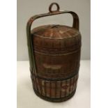 A South East Asian painted raffia work food box of cylindrical form 56 cm high