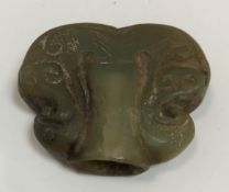 A carved jade snuff bottle decorated with foliage, 5 cm x 5.